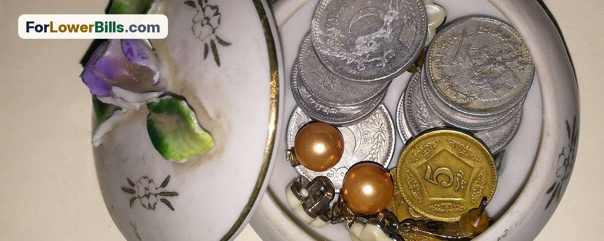 Small dish holding old coins and keepsakes