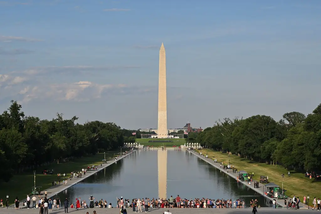 The Washington Monument mirrored in the restored blue Lincoln Memorial Reflecting Pool